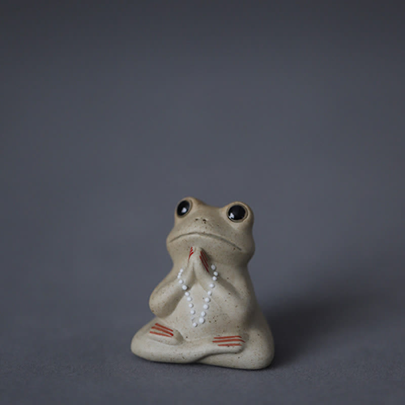 Statue de petite grenouille en céramique en méditation