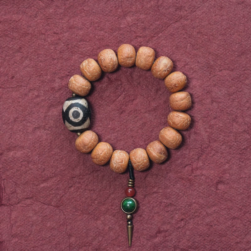 Bracelet Mala Bodhi 14 mm et Perles Dzi Artisanales La force symbolique des graines sacrées