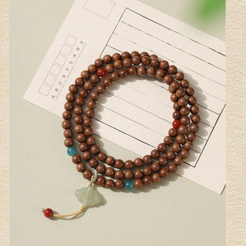 Bracelet Mala en Bois de Santal Ancien – Symboles Sacrés & Pierres Naturelles